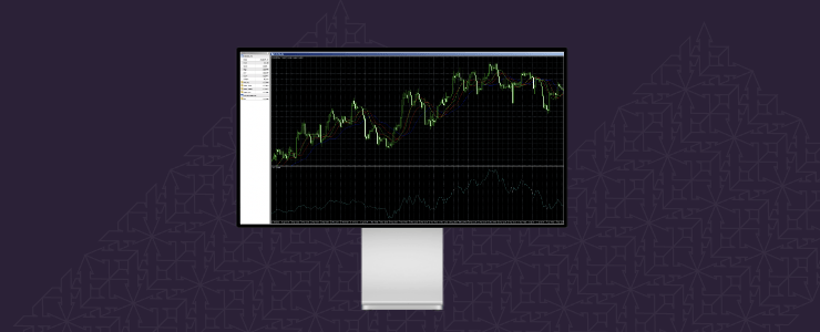 A computer monitor shows a colorful stock market graph with fluctuating lines and data points.
