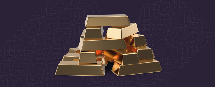 A stack of gold bars resting on a vibrant purple background, highlighting their shine and luxury.